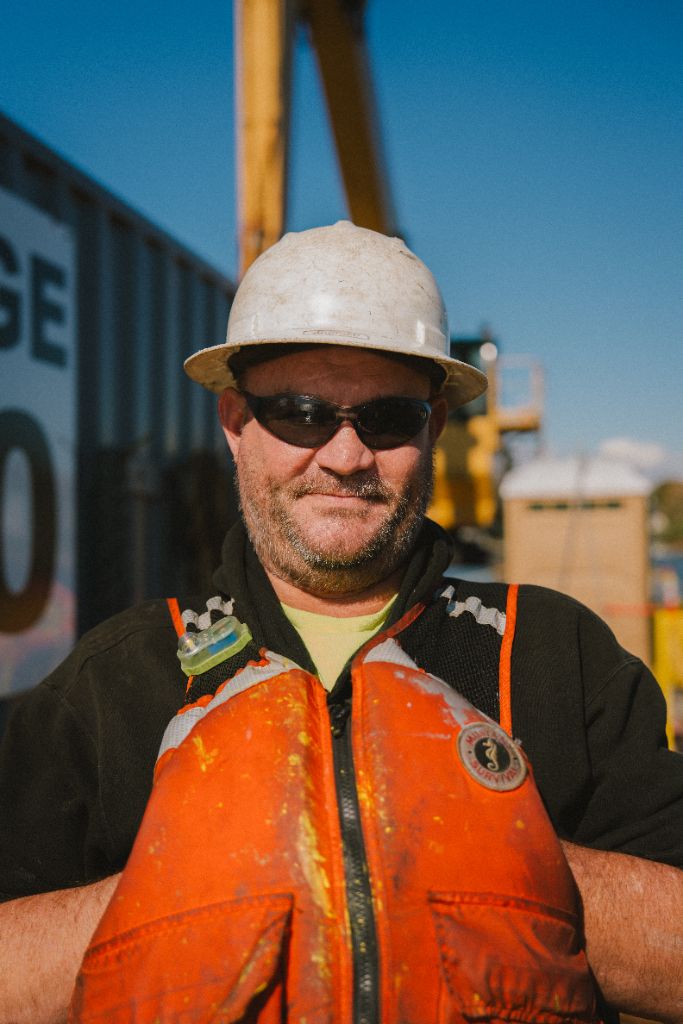 Patriot Marine crew member wearing required PPE and life vest
