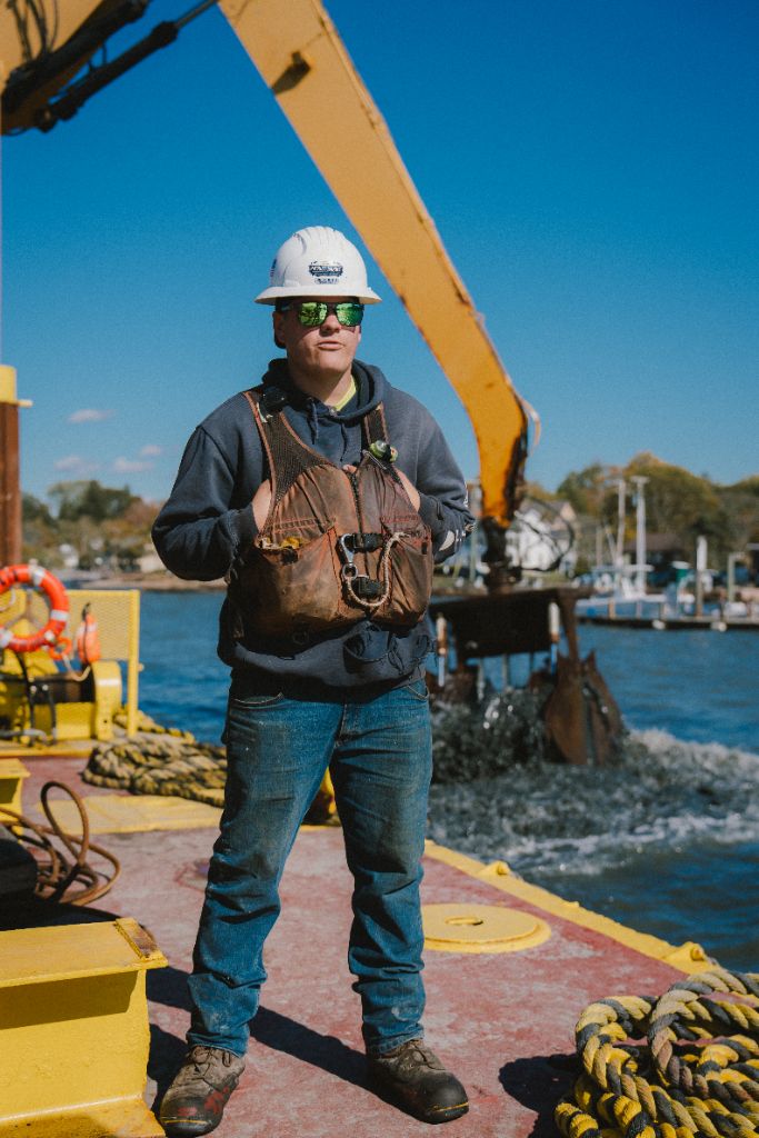 Patriot Marine deckhand on the barge deck