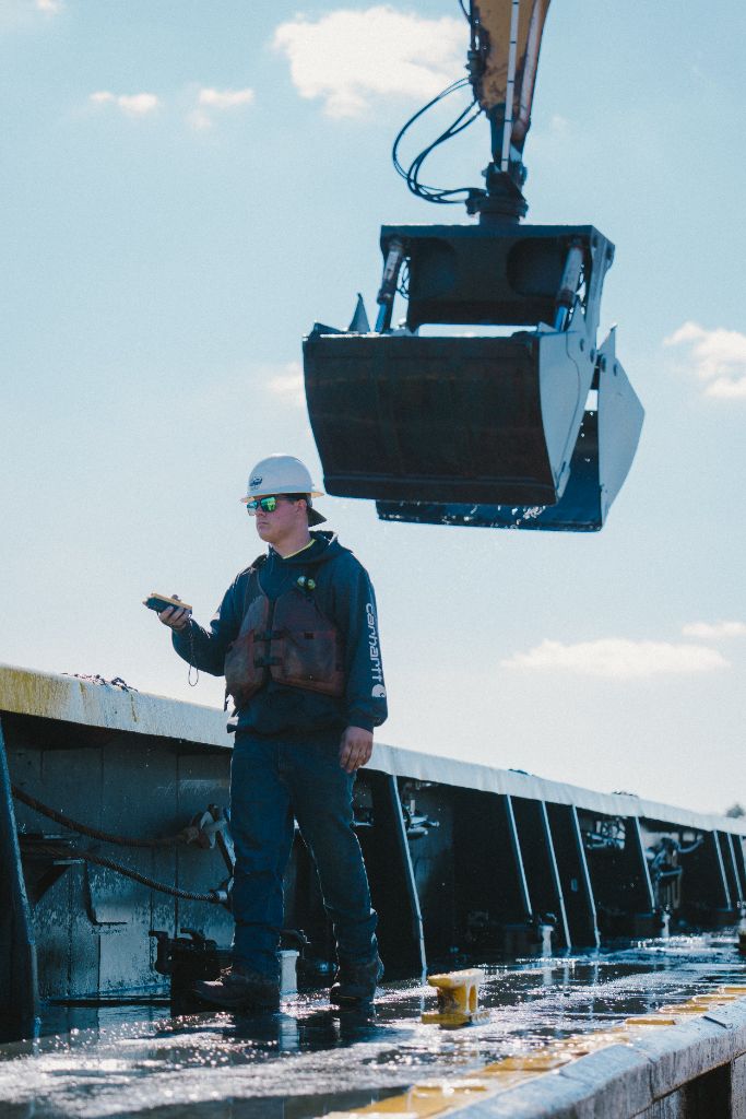 Patriot Marine deckhand operating equipment controls during hands-on training